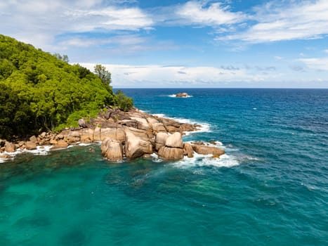 Rocky Coast of Mahe Island with turquoise water. Seychelles.
