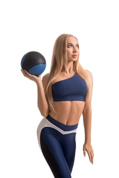 Pretty blonde fitness model with a ball isolated shot