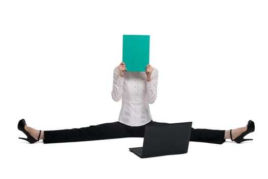 Business woman in white tshirt with green paper pack and notebook sitting on the floor isolated view