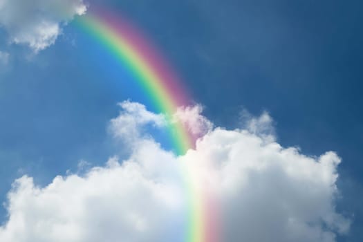 Cloudscape rainbow of natural sky with blue sky and white clouds and colorful rainbow in the sky use for wallpaper background
