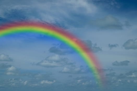 Nature cloudscape with blue sky and white cloud with rainbow