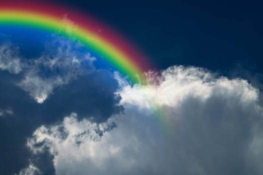 Cloudscape rainbow of natural sky with blue sky and white clouds and colorful rainbow in the sky use for wallpaper background