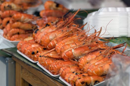 Grilled shrimp in foam box at Thai market