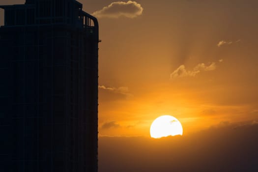 Evening Sky with Sunset and silhouette building in city