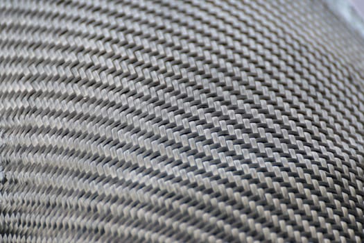 Wrapping carbon fiber or kevlar and man hand for working