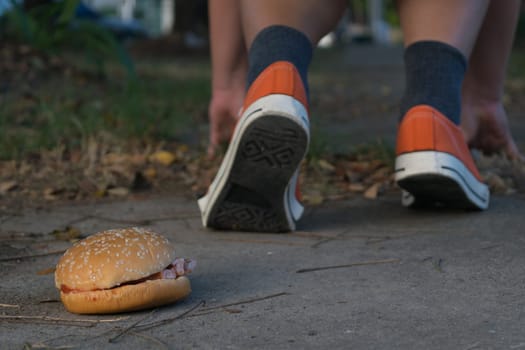 Good bye junk food hamburger left to jogging exercise