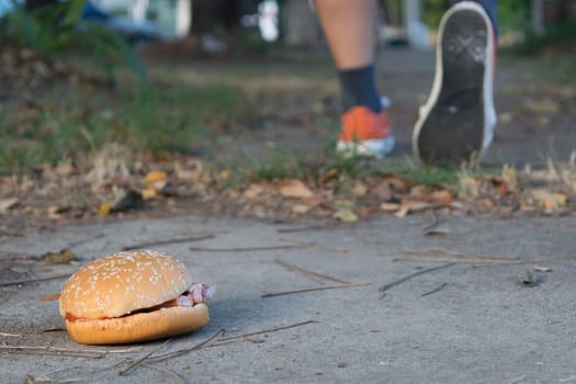 Good bye junk food hamburger left to jogging exercise