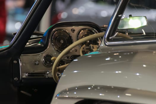 Zoom at classic car console with steering wheel in Car show event at Bangkok, Thailand. This a open event no need press credentials required.