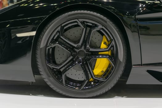 Zoom at sports car wheel and fender in Car show event at Bangkok, Thailand. This a open event no need press credentials required.
