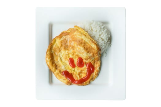 Omelet rice in white dish with smiling chilli sauce. isolated on white background.