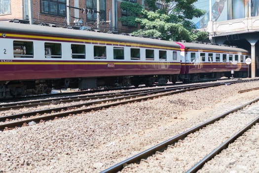 Bangkok, Thailand - December 30, 2015 : Unidentified railway train run on the railroad tracks. Many people in Thailand popular travel by train because it is cheaper.
