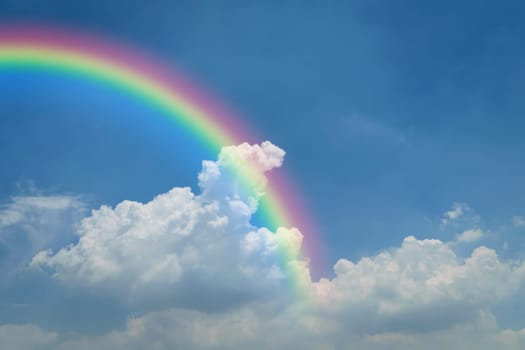 Nature cloudscape with blue sky and white cloud with rainbow