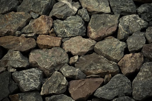 Stone wall texture background surface natural color , process in vintage style