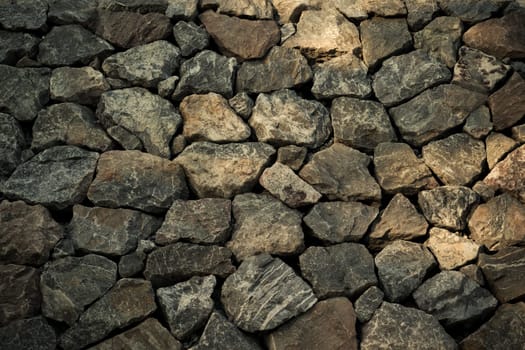 Stone wall texture background surface natural color , process in vintage style