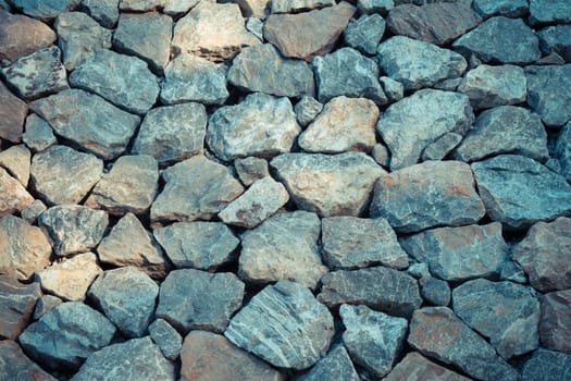 Stone wall texture background surface natural color , process in vintage style