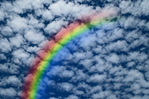 Nature cloudscape with blue sky and white cloud with rainbow