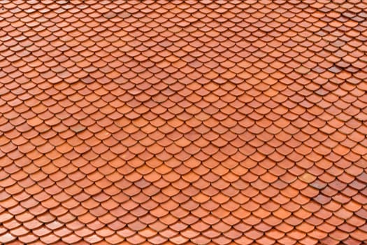 Tile roof of old Thai temple texture background surface natural color
