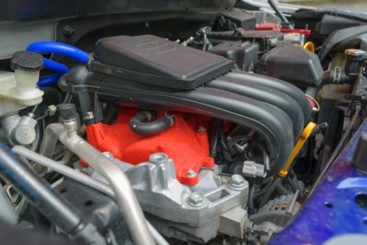 Closeup photo of a clean car engine. Selective focus on air flow
