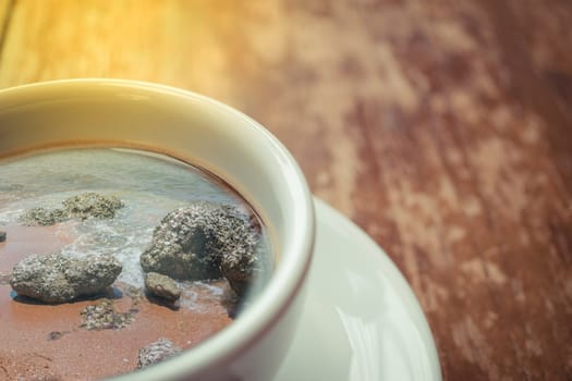 Beach and tropical sea with rock in nature reflection on coffee , process in soft orange sun light style