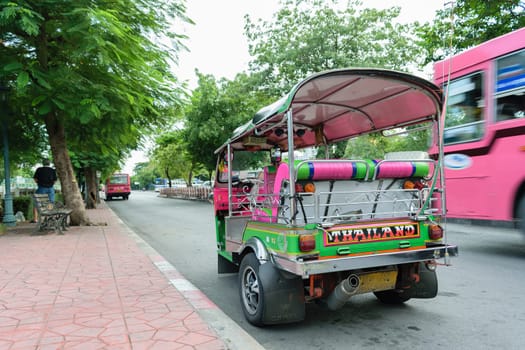 Bangkok, Thailand - September 5, 2015 : Thai TukTuk taxi parking in the row on the road in Bangkok, Thailand.