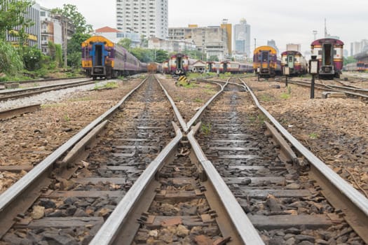 Railroad tracks crossing of a Public Thai Train Railway