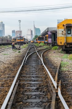 Bangkok, Thailand - September 5, 2015 : Unidentified railway train on the railroad tracks in Bangkok station. Many people in Thailand popular travel by train because it is cheaper.