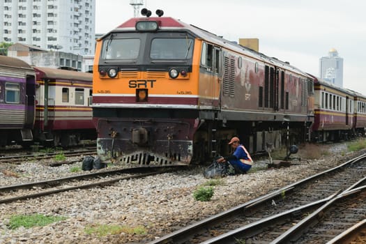 Bangkok, Thailand - September 5, 2015 : Unidentified railway employees controlling the locomotive for switching the railway before serving at State Railway of Thailand.