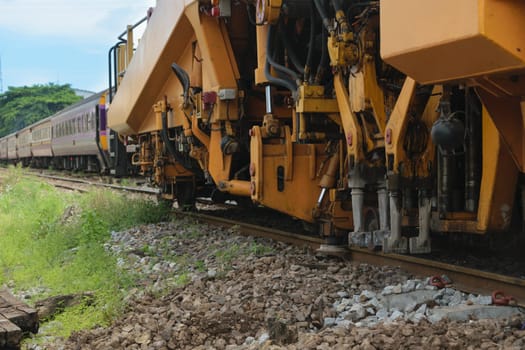 Bangkok, Thailand - September 5, 2015 : Restoration the railroad tracks by Plasser and Theurer machine at State Railway of Thailand.