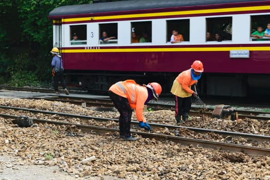 Bangkok, Thailand - September 5, 2015 : Unidentified railway employees working for restoration the railroad tracks before serving at State Railway of Thailand.