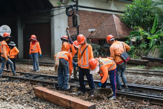 Bangkok, Thailand - September 5, 2015 : Unidentified railway employees working for restoration the railroad tracks before serving at State Railway of Thailand.