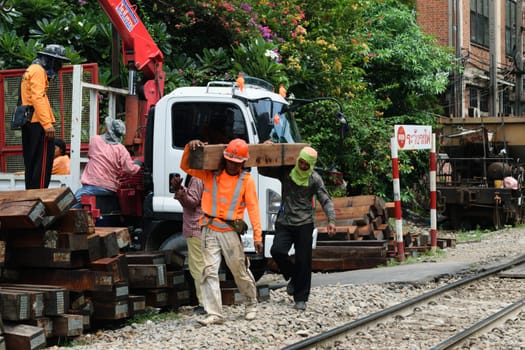 Bangkok, Thailand - September 5, 2015 : Unidentified railway employees working for restoration the railroad tracks before serving at State Railway of Thailand.