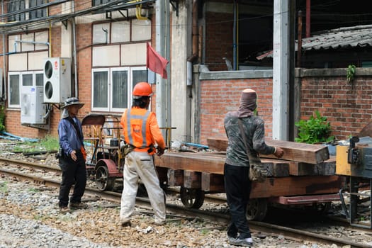 Bangkok, Thailand - September 5, 2015 : Unidentified railway employees working for restoration the railroad tracks before serving at State Railway of Thailand.