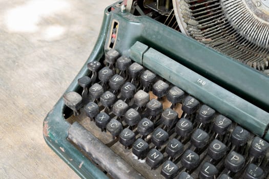 Typewriter antique vintage style on a old wood table