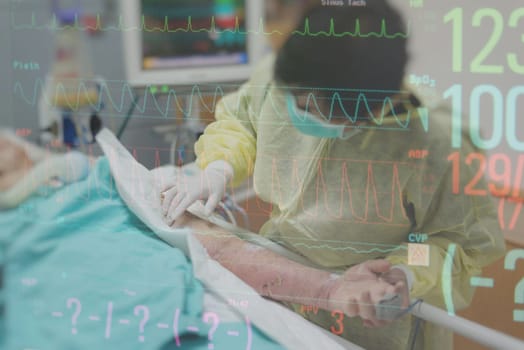 Asian women 40s years old in isolation gown non-sterile coat is a patient relative taking care of the CRE. or VRE. infected elder patient 80s years old on bed in the hospital with graph for heart rate
