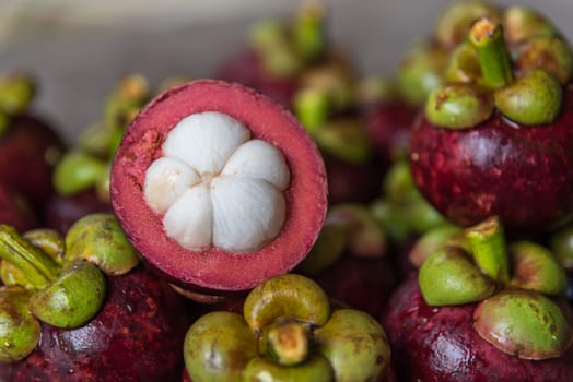Mangosteen on a wood table is a queen of fruit in Thailand and asia fruit have a sweet can buy at Thai street food and fruit market