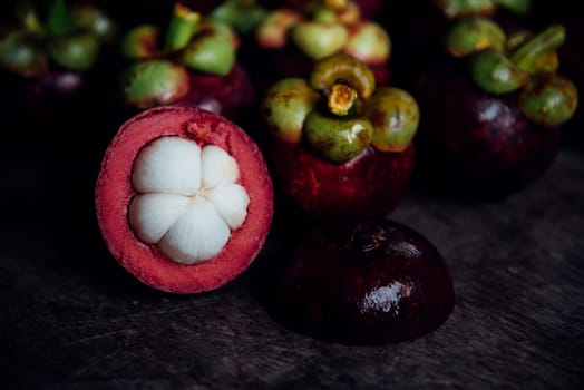 Mangosteen on a wood table is a queen of fruit in Thailand and asia fruit have a sweet can buy at Thai street food and fruit market