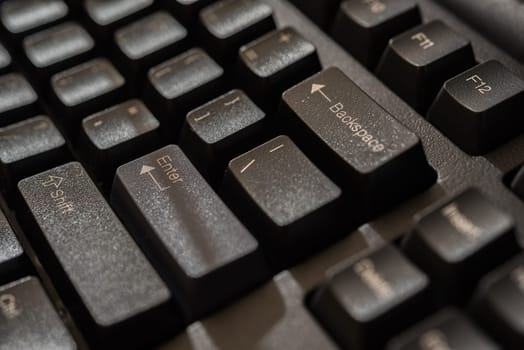 Keyboard for computer server or desktop computer focus on enter button on a keyboard in office, business and information technology concept