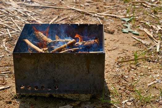 a portable heater consisting of a pan or stand for holding lighted coals