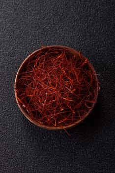 Red thin hot chili threads on a dark background. For decorating Asian dishes