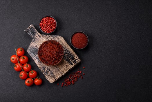Red thin hot chili threads on a dark background. For decorating Asian dishes