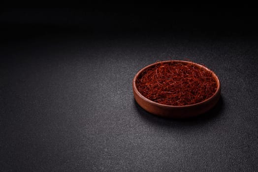 Red thin hot chili threads on a dark background. For decorating Asian dishes
