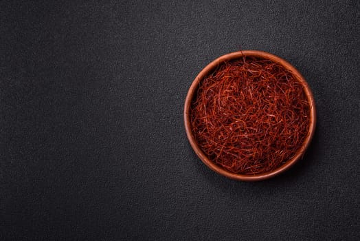 Red thin hot chili threads on a dark background. For decorating Asian dishes