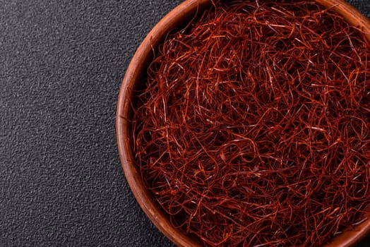 Red thin hot chili threads on a dark background. For decorating Asian dishes
