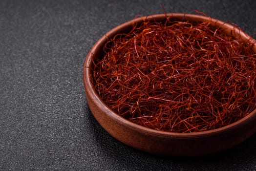 Red thin hot chili threads on a dark background. For decorating Asian dishes