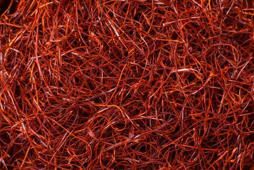 Red thin hot chili threads on a dark background. For decorating Asian dishes