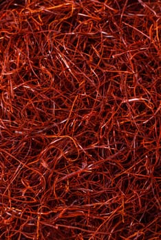 Red thin hot chili threads on a dark background. For decorating Asian dishes