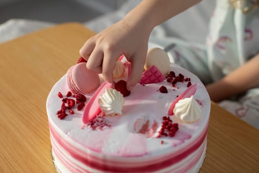 An exquisitely decorated cake adorned with vibrant macarons and light, fluffy cream, perfect for any celebration
