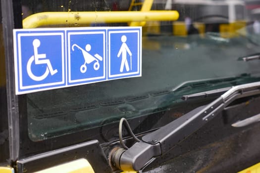 Bus signs highlight accessibility for wheelchairs, strollers, and pedestrians.