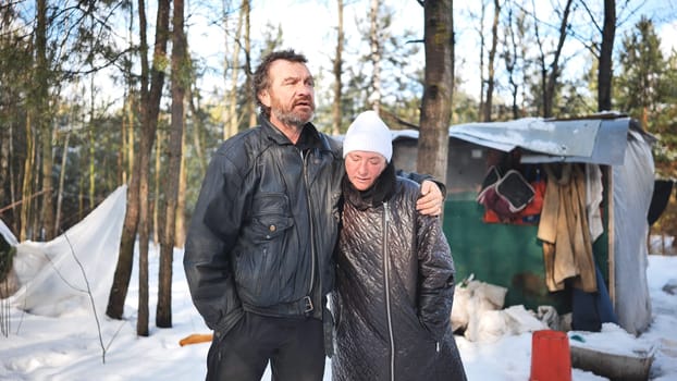 Homeless pair surviving harsh winter conditions, struggling with alcoholism in remote woodland setting