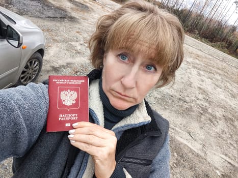 Driver girl with Russian passport and car. Russian cars banned for entering in Europe. Russian tourism closed during war of Russia and Uk. Confiscation of Russian car and sanctions against Russians